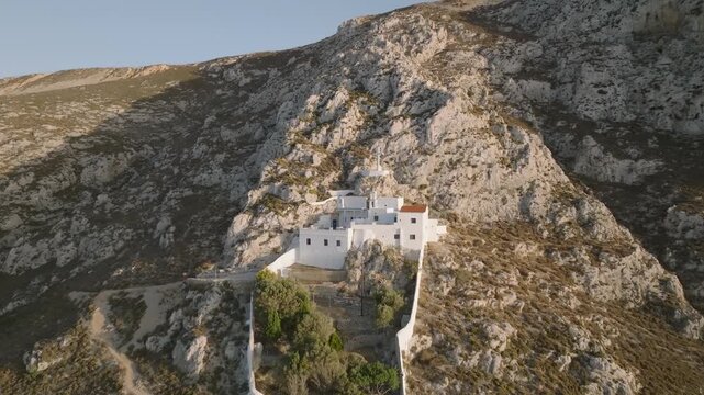 Aerial drone footage of the Monastery of Hozoviotissa, a historic white building perched