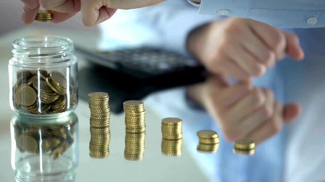 Man counting coins, increase of income, financial pyramid concept, investment.