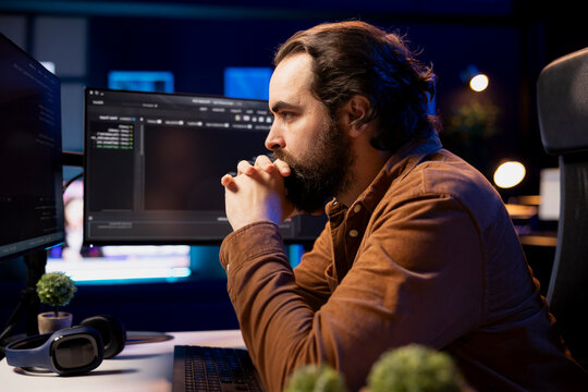 Pensive computer engineer thinking how to futureproof company network from downtimes and unexpected system failures.