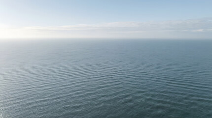 Fototapeta premium Wide ocean horizon with light cloud cover