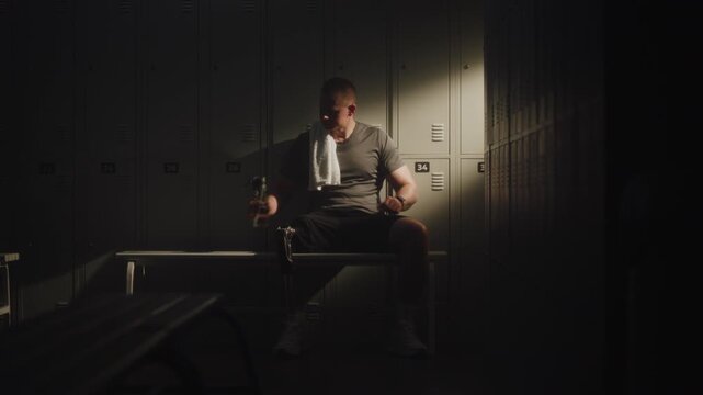 Man Sits Leaning Back in Moment of Rest After Workout. Lifestyle of Modern Para Athlete in Sports Facility. Advanced Bionics, Rehabilitation Success Stories, and Disability Representation in Sports.