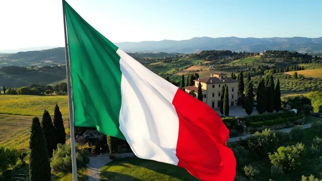Italian Flag Waving over Tuscany Countryside with Villa
