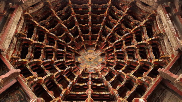 Ornate traditional Chinese temple ceiling with wood carvings