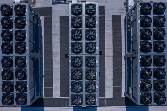 Aerial view of data center with ventilators, advanced technology cooling systems, HVAC at data center rooftop, cooling infrastructure for server operations