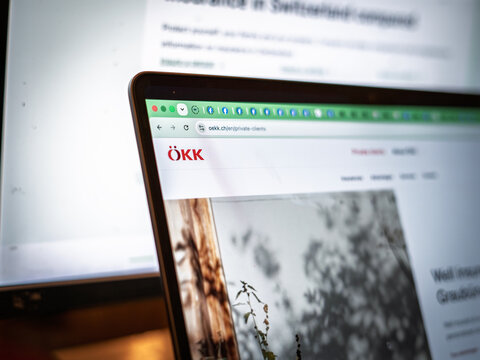 BERN, SWITZERLAND - JUNE 9, 2026: A laptop displays the OKK logo on the insurer website. OeKK Offentliche Krankenkassen der Schweiz is a Swiss insurance company active in health and accident insurance
