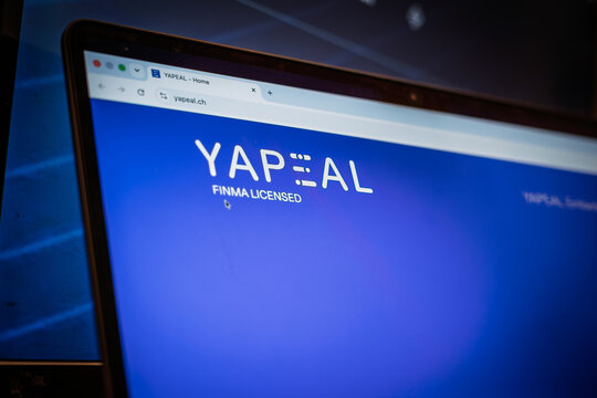 BERN, SWITZERLAND - JUNE 9, 2026: Yapeal website logo on a laptop with a FINMA licensed message. YAPEAL is a Swiss digital finance provider focused on mobile banking and payment services.