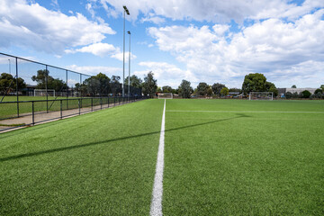 A well-maintained synthetic turf or fake grass ground football pitch at an Australian suburban sports ground. Community sport, recreational infrastructure © Doublelee