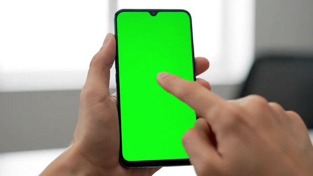 hand holding smartphone with greenscreen displaying love icon minimal mockup clean modern mobile interface template social media reaction concept 4k footage