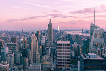 Fototapeta premium Aerial view of New York city at night, Manhattan, USA, magenta toned
