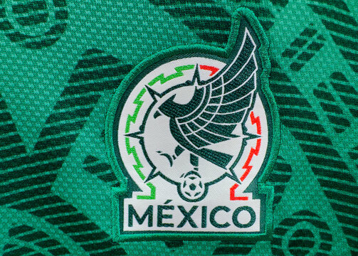 Calgary, AB, Canada. June 15, 2026. Macro close-up of an embroidered Mexico national football team crest patch on a textured green jersey.