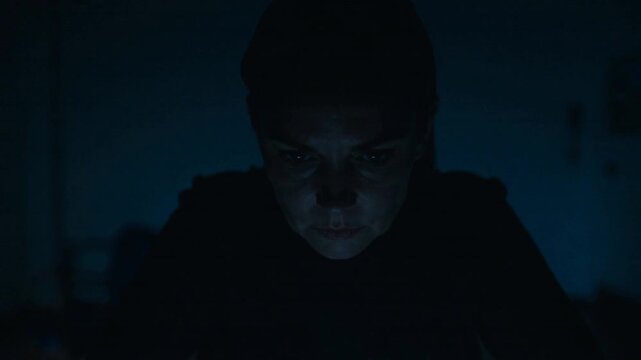 Woman Obsessed with Phone in Dark Room