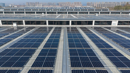 Large Scale Solar Panels Installed On Building Rooftops © Zhaorui