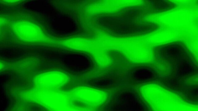 Bright green neon liquid flowing and swirling in darkness