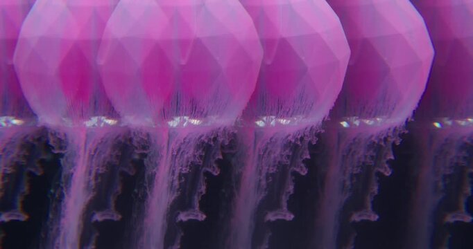 Paint spill. Blur kaleidoscope. Pink dye pouring on diamond sphere. Doubled lens effect pigment dissolving water abstract black background.