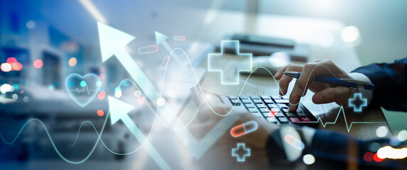 Businessman use calculator to analyze healthcare business graph data,representing medical growth investment,health insurance cost estimation,financial report,medical business,rising growth in hospital © Zerofukuman