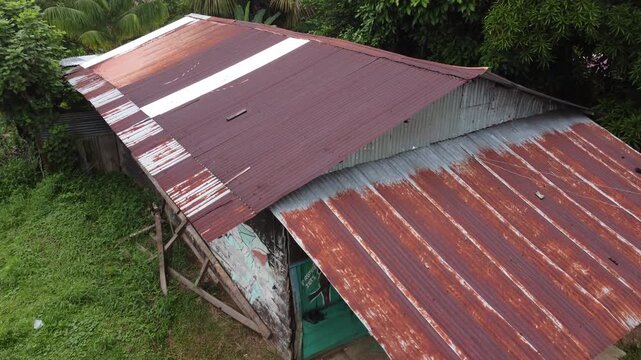 Rusty corrugated metal roof on a house in the peruvian jungle
