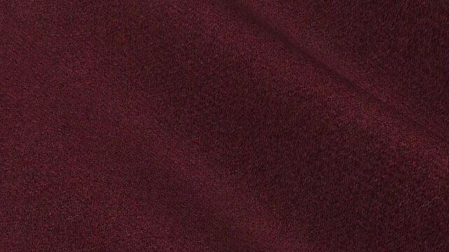 Burgundy Heavy Tweed Fabric cascading in deep wine red waves of rich winter wool texture for premium country style autumn outerwear clothing