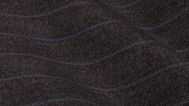Italian Charcoal Pinstripe Wool Twill Fabric flowing in classic waves of executive corporate stripe pattern and premium dark gray suit texture