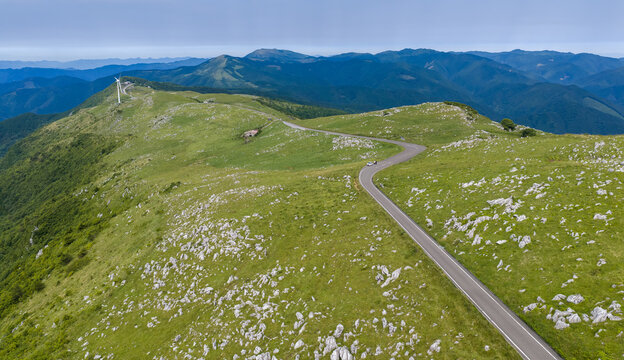 Winding Ridge Road and Wind Turbine on the Open Shikoku Karst Plateau