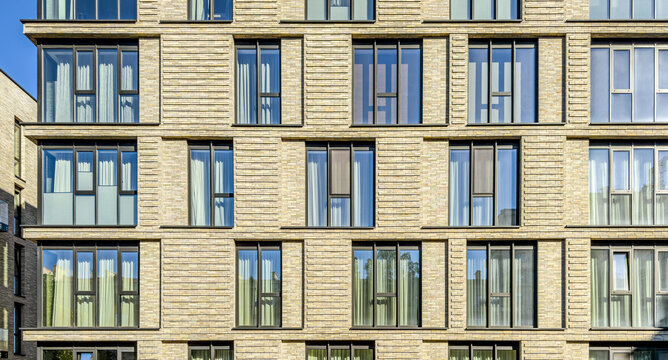 modern multifamily residential building with architectural details. exterior front view.
