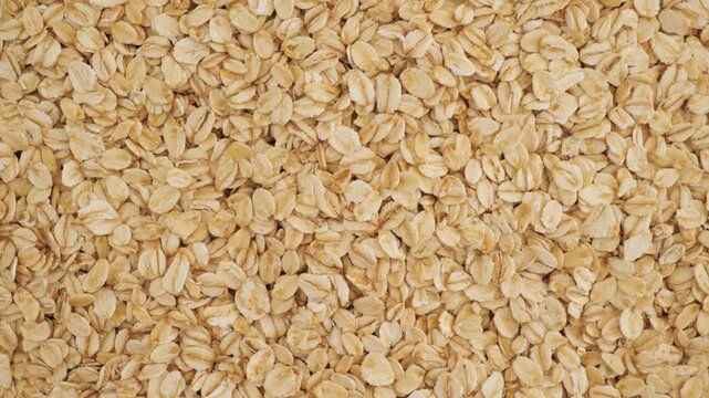 Healthy raw rolled oats rotating for breakfast