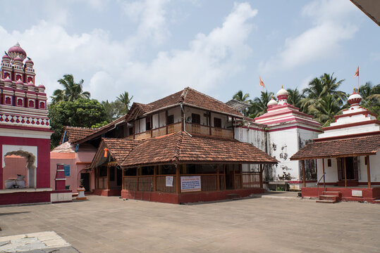 Shri Rameshwar temple or mandir, ancient temple of Lord Shiva, surrounded by coconut palm trees. In front of the temple there is a Pushkarini (stepped well). Chaul, Alibag, Raigad, Maharashtra, India.