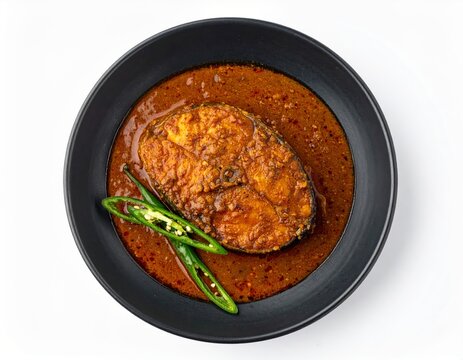 Malabar Ginger Fish Curry Inji Meen Kuzhambu In Charcoal Bowl Isolated On White Background
