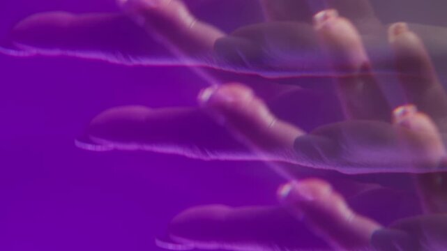 Palm hand movements. Defocused crystal effect. Female fingers with manicure showing various gestures. Neon color glow performance abstract background.