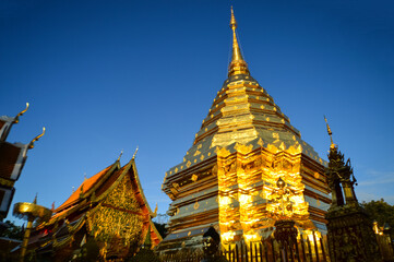 Naklejka premium Chapel and Golden Pagoda, Lanna Architecture, Symbols of Buddhism, South East Asia at Wat Phra That Doi Suthep, Chiangmai, Northern Thailand