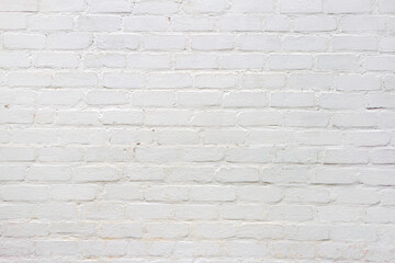 Fototapeta premium White brick wall background. Texture of painted masonry surface. Architectural backdrop for interior design and construction projects.