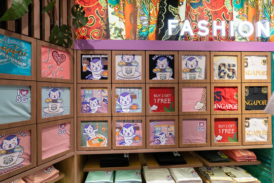 T-shirts with Merlion prints on display in Discover Singapore souvenir store