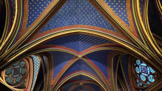 Magnificent Rayonnant Gothic vaulted ceiling of the Sainte-Chapelle in Paris, with its rich blue and gold details, a masterpiece of medieval architecture and a renowned historic landmark in France