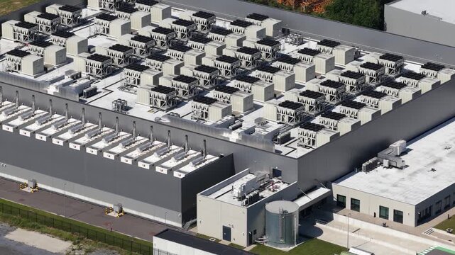 Aerial drone view of a data center supporting big data, machine learning, AI infrastructure, cloud computing and digital storage.