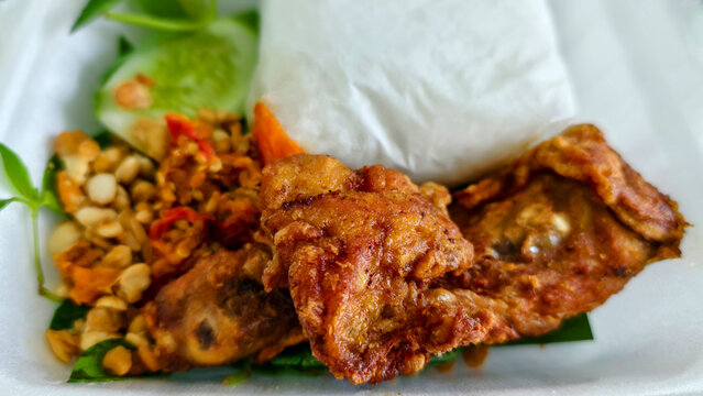 Delicious fried chicken with rice and spicy tempeh, a delicious Southeast Asian dish