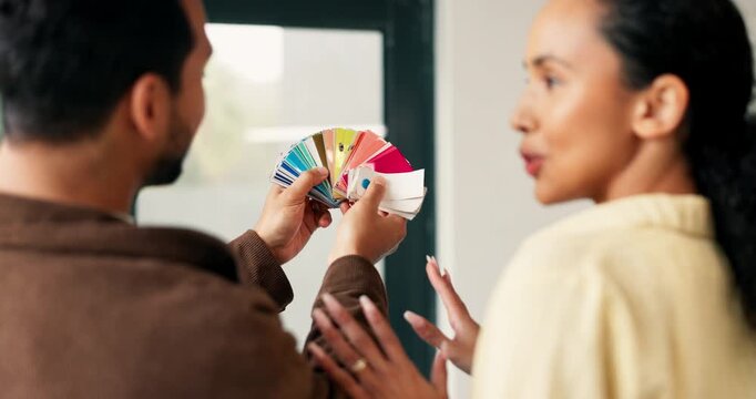 Back, couple and talk art new house with swatches, paint sample and ideas for interior design. People, discussion and planning in lounge with color palette, renovation and diy makeover for remodeling