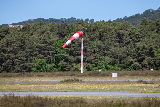 red and white windsock at an airport