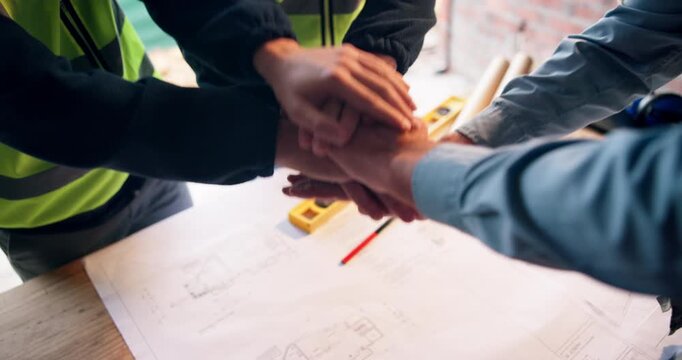 Architect, team or blueprint with hands together for building design, mission or collaboration. Top view, people or group of contractors piling with stack or floor plan for unity on construction site