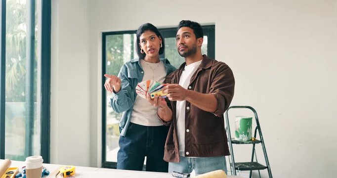 Couple, discussion and moving in new house with color swatch, interior design decision or renovation. Married people, talk and paint options in home for remodeling project, property upgrade and plan.