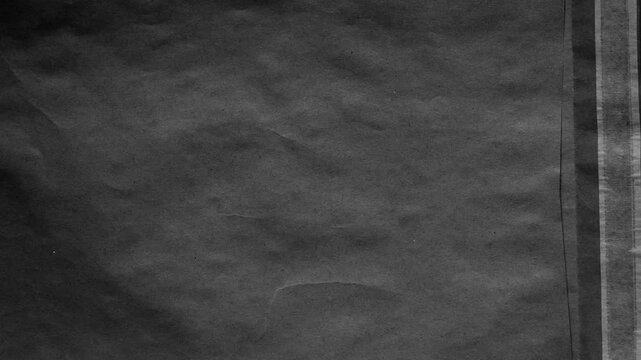 Grey paper with subtle stains and vertical edge detail