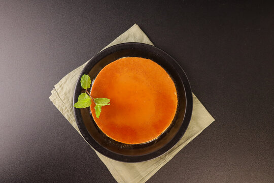 Quesillo is a creamy Latin American caramel custard dessert made with eggs, milk, sugar, and vanilla.