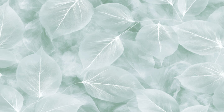 Green leaves on icy blue winter frost textured background with snow crystal pattern