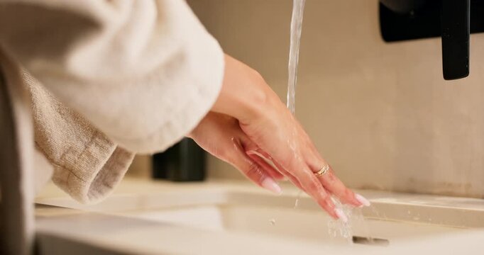 Sink, washing hands and water with woman in bathroom of home for disinfection or hygiene. Basin, cleaning and skincare with person in apartment to remove bacteria or germs for self care routine
