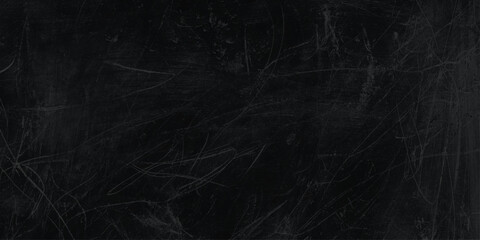 Dark scratched blackboard background texture with white marks and scratches for design and education concepts © Daiyan