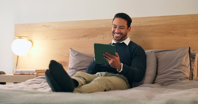 Businessman, relax or hotel with tablet in bedroom for business network, social media or schedule. Happy man, employee or traveler with smile on technology for internet, connection or browsing in bed