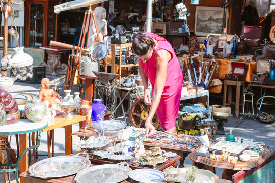 Woman browsing at a flea market in the center of Athens, Greece