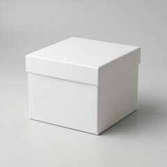 Naklejka premium A clean white square cardboard box sits perfectly centered against a soft neutral grey studio background creating a minimalist aesthetic for modern product display design concepts