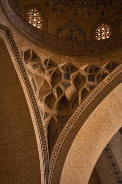 Intricate brick squinch supporting a dome in an Islamic mosque.