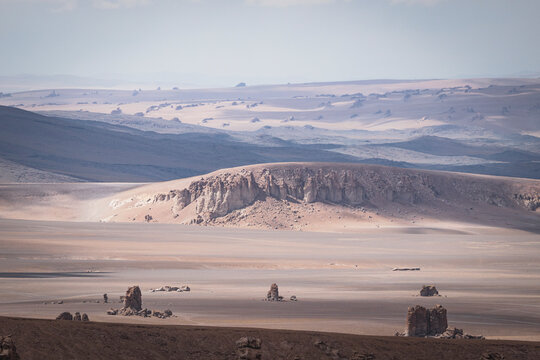 Expansive hazy view of a desolate desert landscape