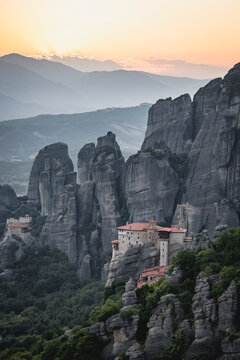 Ancient Greek monasteries on cliffs at sunrise