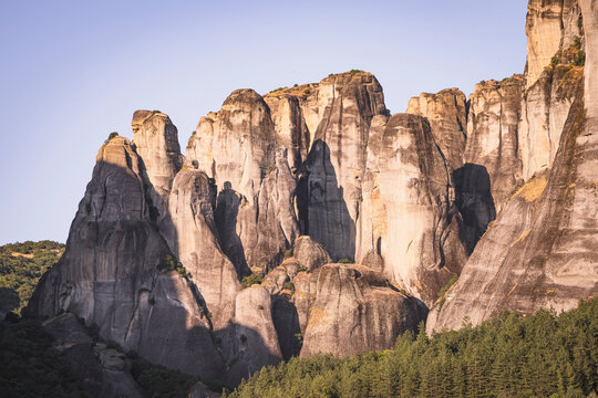 Sunlight hits the giant rock pillars of Meteora Greece